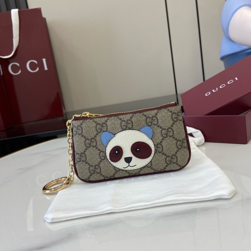 G*u*i clutch bags